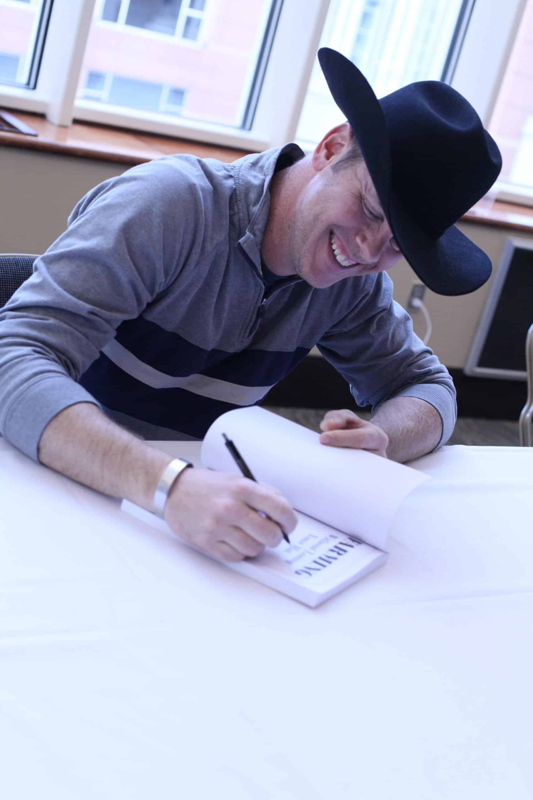 Paul Dorrance signing book