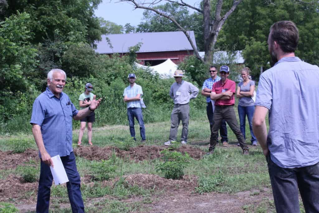 Gary Zimmer teaching in elderberry field