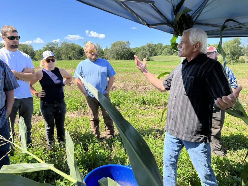 Gary Zimmer presents in the field at the On-Farm Intensive