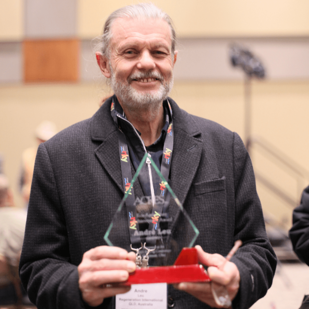 Andre Leu holds his Eco-Ag Achievement Award